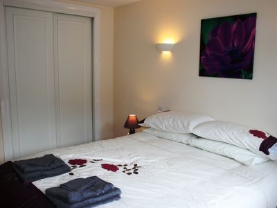 Master bedroom with kingsize bed Flat on the Green Three