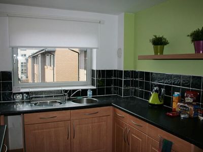 Kitchen with washer/dryer, dishwasher, oven and hob and fridge freezer. St Andrews