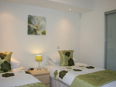Twin bedroom at FotG6 Flat on the Green Six